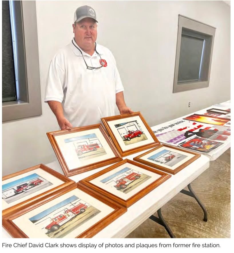 Fire Chief David Clark with historical fire department displays